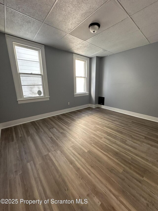 1353 Capouse 1351, Scranton, PA 18510 - empty room featuring baseboards, a drop ceiling, and wood finished floors