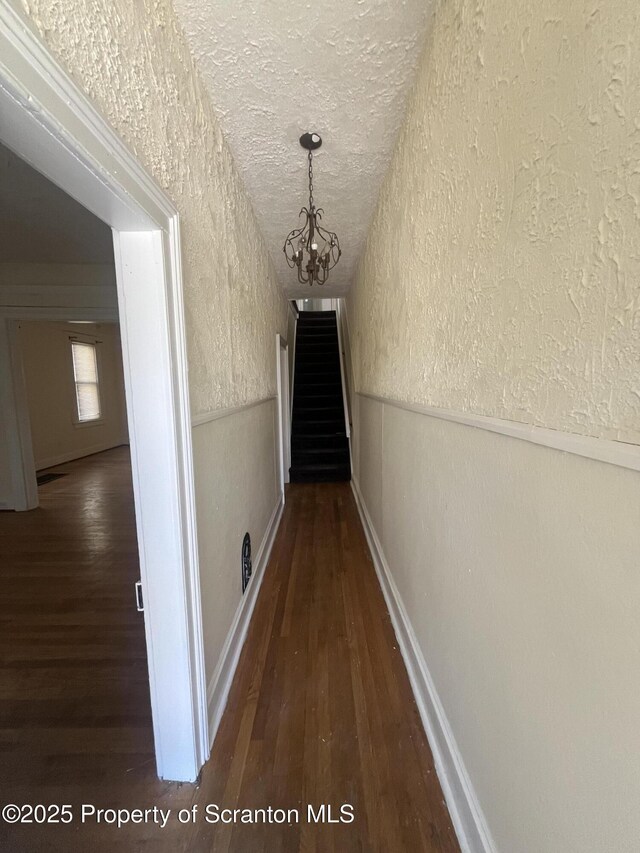 1353 Capouse 1351, Scranton, PA 18510 - corridor featuring a notable chandelier, a textured wall, a textured ceiling, wood finished floors, and a wainscoted wall