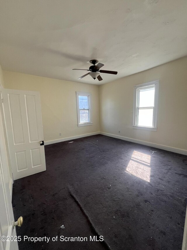 1353 Capouse 1351, Scranton, PA 18510 - empty room with dark carpet, baseboards, and ceiling fan