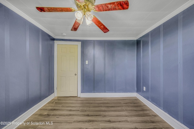 826 Moltke Ave, Scranton, PA 18505 - empty room with wood finished floors, ornamental molding, a decorative wall, and ceiling fan