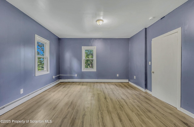 826 Moltke Ave, Scranton, PA 18505 - unfurnished room featuring wood finished floors, baseboard heating, and a baseboard radiator