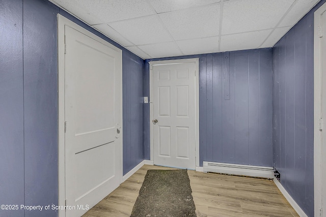 826 Moltke Ave, Scranton, PA 18505 - interior space with light wood finished floors, a paneled ceiling, and a baseboard radiator