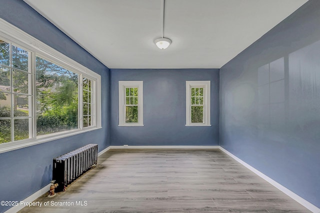 826 Moltke Ave, Scranton, PA 18505 - spare room with radiator and wood finished floors
