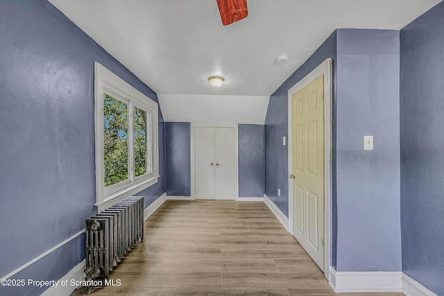 826 Moltke Ave, Scranton, PA 18505 - unfurnished room with radiator, wood finished floors, and vaulted ceiling