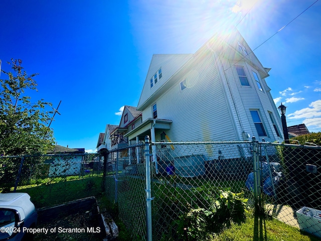 view of home's exterior featuring fence