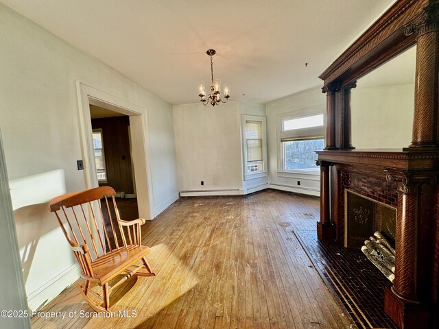 dining area featuring carpet floors, a fireplace, and a chandelier