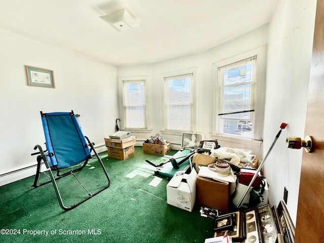 misc room with carpet flooring and a baseboard radiator