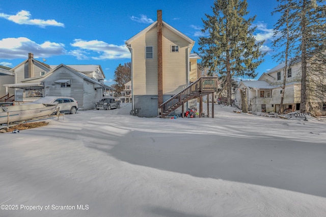 view of snow covered house