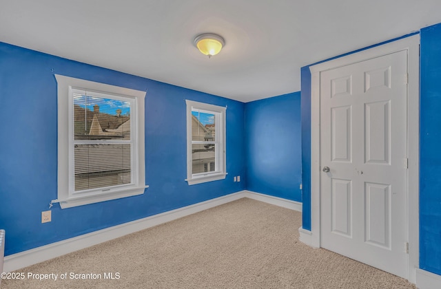 unfurnished room with carpet floors