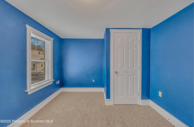 unfurnished bedroom featuring carpet