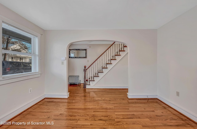 foyer featuring radiator heating unit and light wood-type flooring