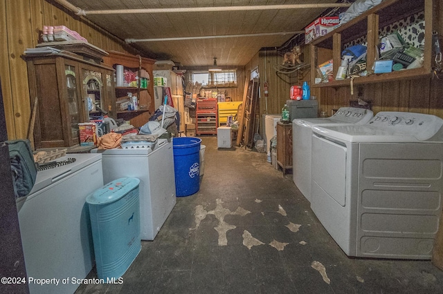 laundry room with wood walls, wooden ceiling, and independent washer and dryer