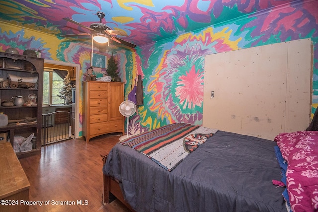 bedroom featuring hardwood / wood-style flooring and ceiling fan