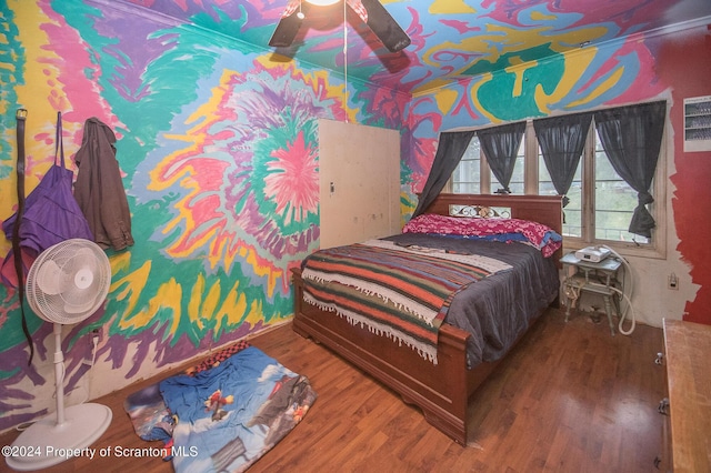 bedroom featuring ceiling fan and wood-type flooring