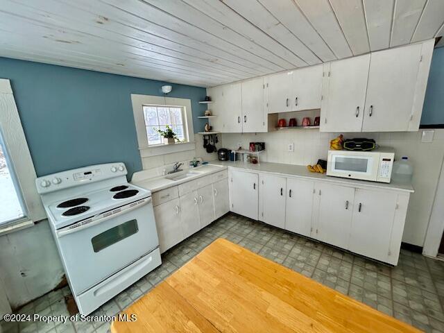 kitchen featuring sink, white appliances, white cabinetry, and wood ceiling