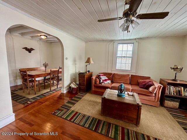 living room featuring hardwood / wood-style floors, ceiling fan, and wood ceiling