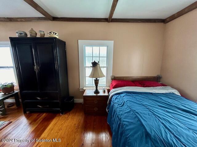 bedroom with hardwood / wood-style floors