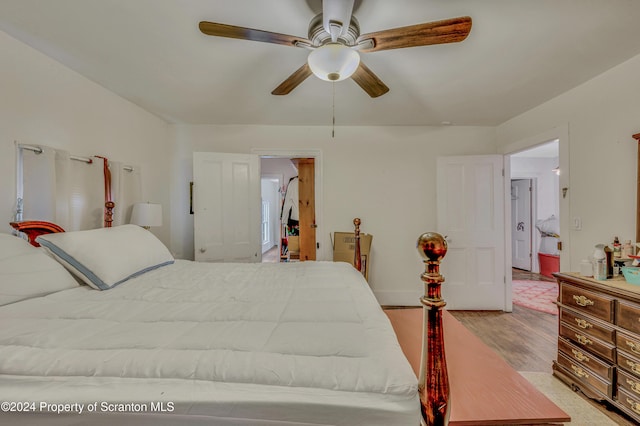 bedroom with light wood-type flooring and ceiling fan