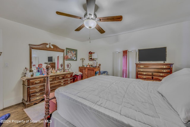 bedroom with ceiling fan and light wood-type flooring