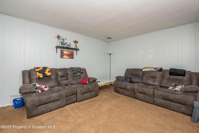 living room featuring carpet floors and visible vents