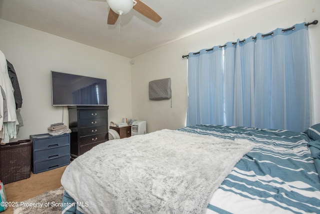 carpeted bedroom with a ceiling fan