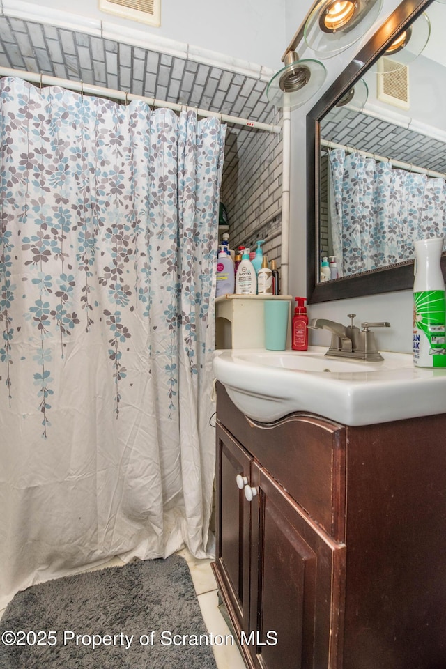 bathroom featuring vanity and a shower with curtain