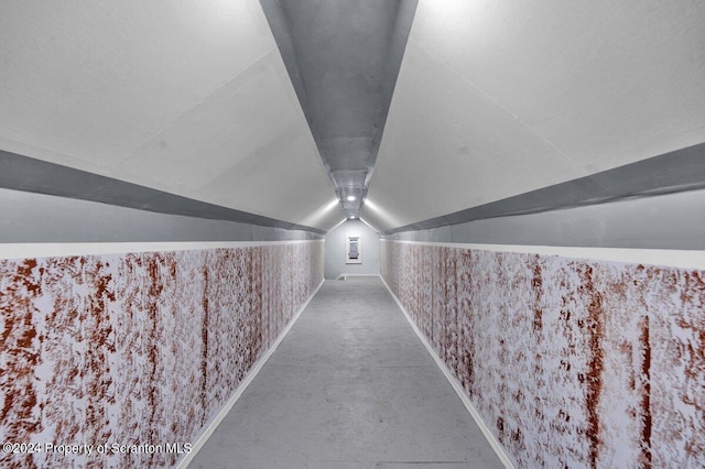 hallway featuring lofted ceiling