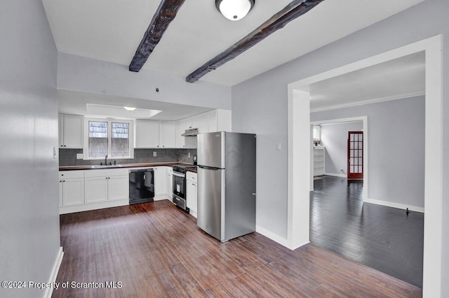 kitchen featuring backsplash, white cabinets, sink, appliances with stainless steel finishes, and beamed ceiling