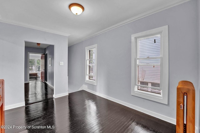 unfurnished room featuring dark hardwood / wood-style flooring and ornamental molding