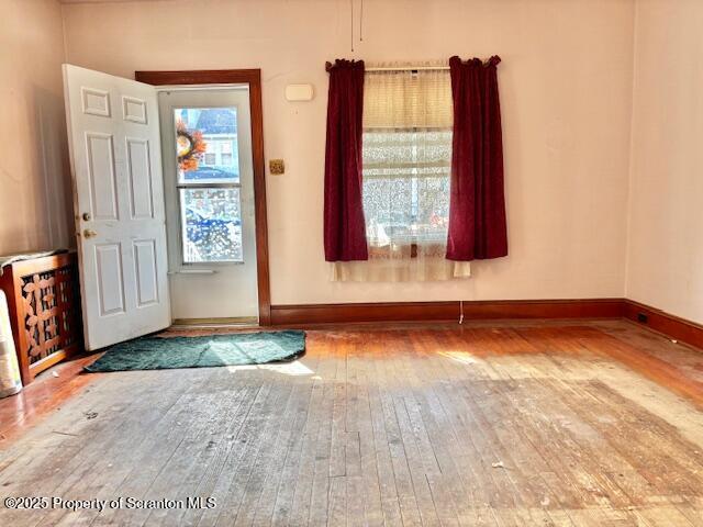 foyer entrance with hardwood / wood-style floors