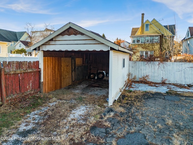 view of outbuilding with a carport