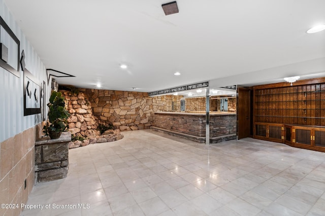 basement featuring bar area