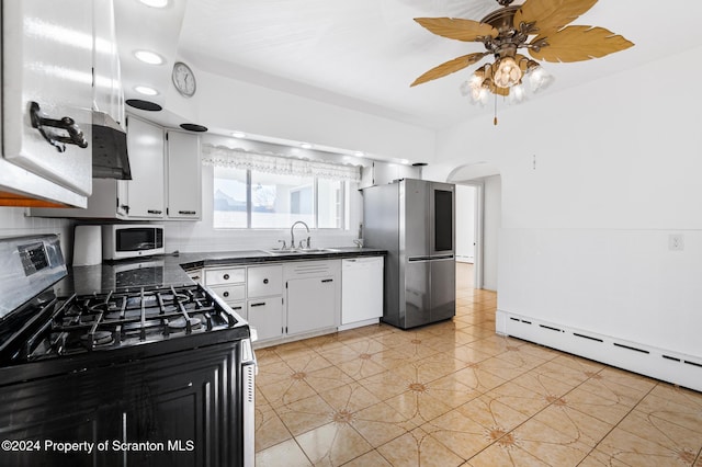 kitchen featuring sink, light tile patterned floors, a baseboard radiator, white cabinetry, and stainless steel appliances