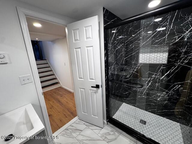 bathroom with a tile shower