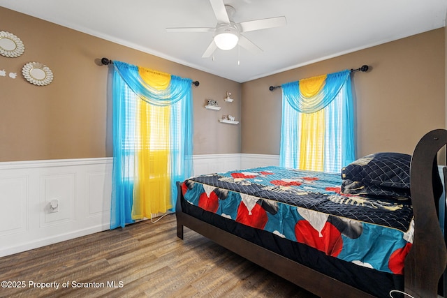 bedroom with ceiling fan and wood-type flooring