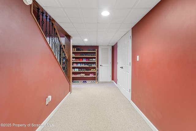 hallway featuring carpet