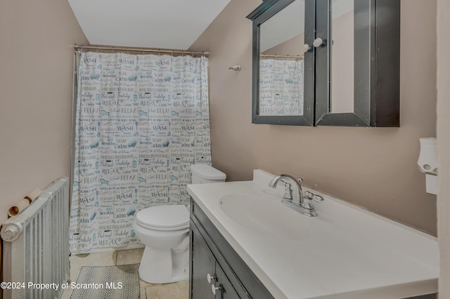 bathroom featuring tile patterned floors, vanity, toilet, and radiator heating unit