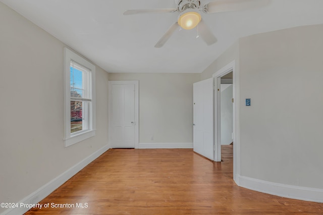 spare room featuring ceiling fan and light hardwood / wood-style floors