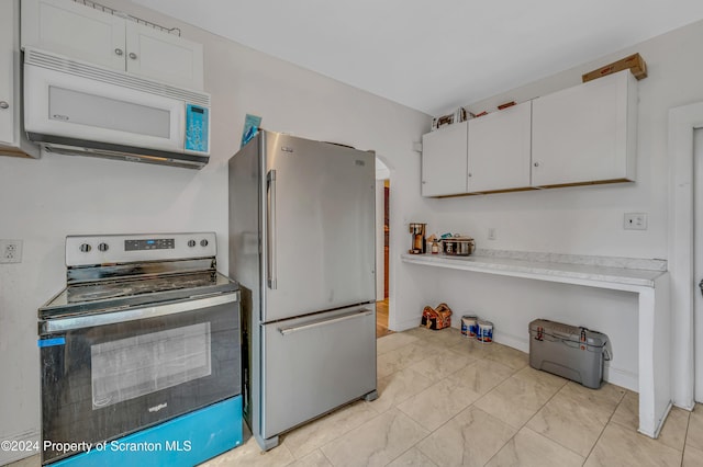 kitchen with white cabinetry and appliances with stainless steel finishes