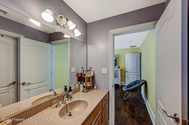 bathroom with vanity and hardwood / wood-style flooring