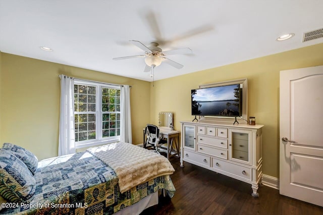 bedroom featuring ceiling fan and dark wood-type flooring