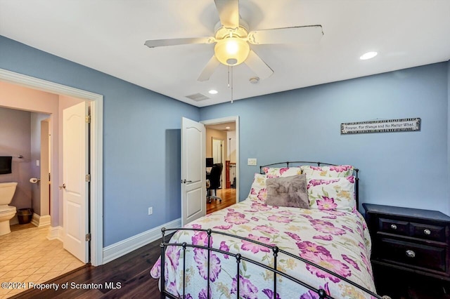 bedroom with wood-type flooring, connected bathroom, and ceiling fan