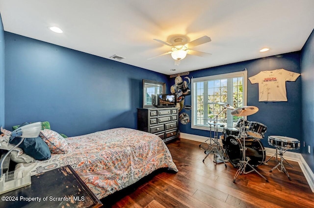 bedroom with ceiling fan and dark wood-type flooring