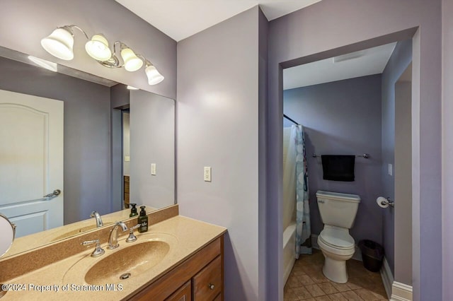 full bathroom featuring tile patterned floors, vanity, toilet, and shower / tub combo with curtain