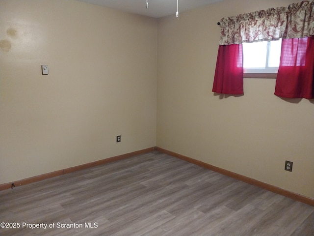 empty room with light wood-type flooring