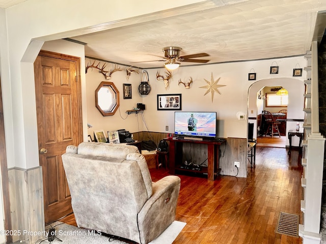 4886 State Route 11, Hop Bottom, PA 18824 - living room with arched walkways, wood-type flooring, a wainscoted wall, and ceiling fan