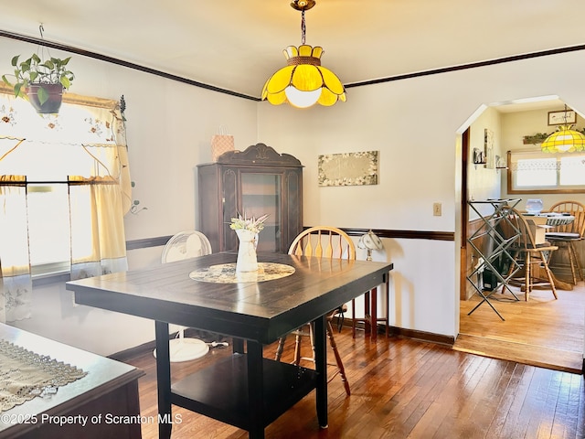 4886 State Route 11, Hop Bottom, PA 18824 - dining room with ornamental molding, baseboards, arched walkways, and hardwood / wood-style flooring
