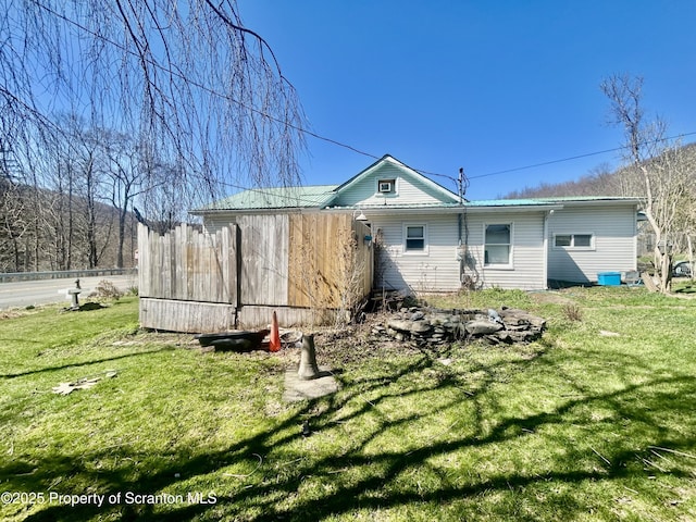 4886 State Route 11, Hop Bottom, PA 18824 - back of house with fence and a lawn