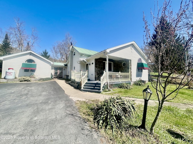 4886 State Route 11, Hop Bottom, PA 18824 - view of front of home featuring a porch, metal roof, and driveway