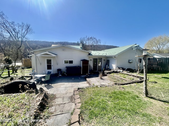 4886 State Route 11, Hop Bottom, PA 18824 - rear view of property with a patio area, metal roof, fence, and a lawn